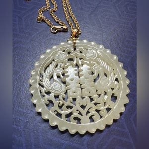 Carved Jade Pendant with 14k gold rope chain.